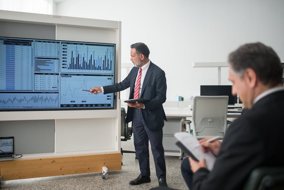 Professional conducts data analysis presentation in a modern office setting